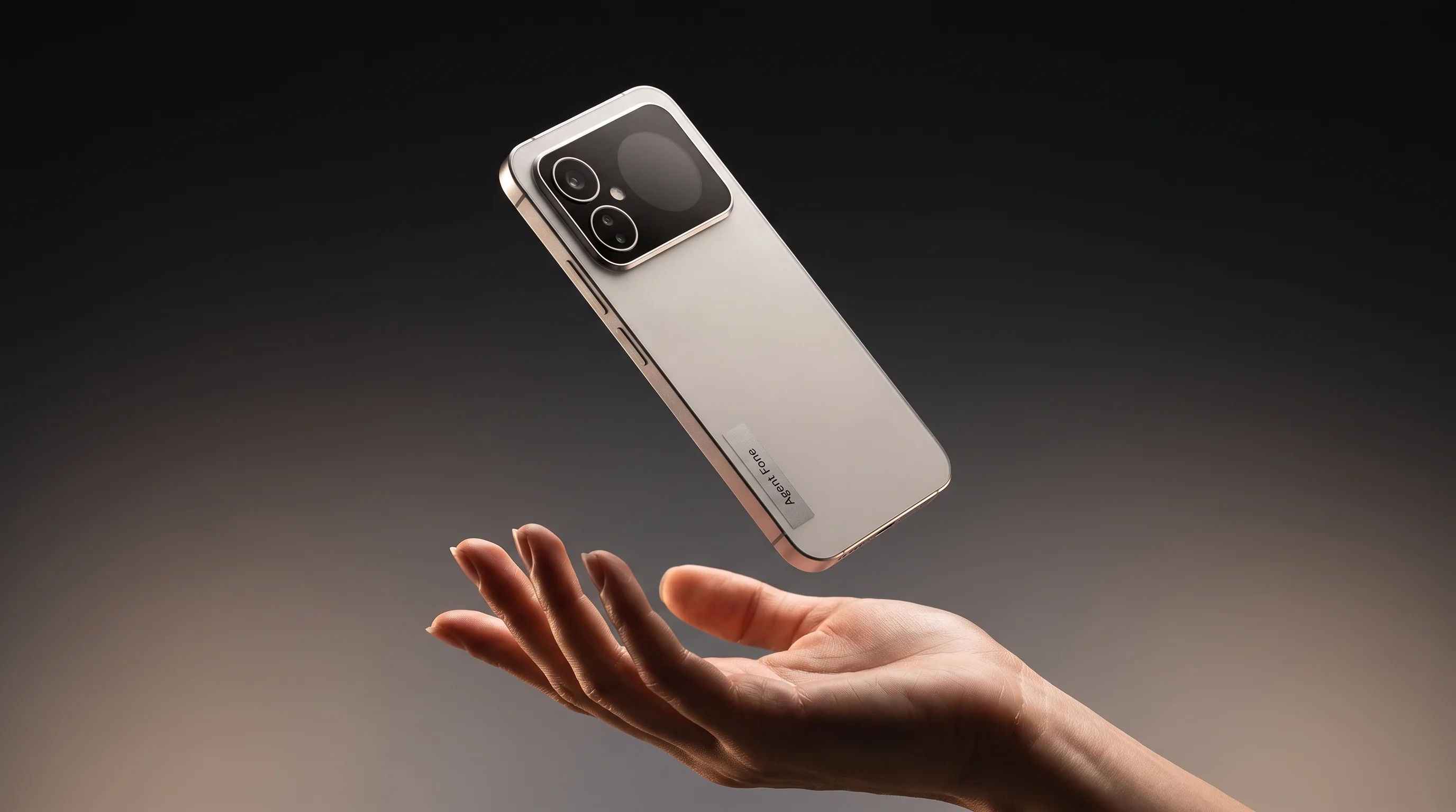 Agent Fone floating above an open palm, warm grey studio ground, rear face and camera plateau visible.